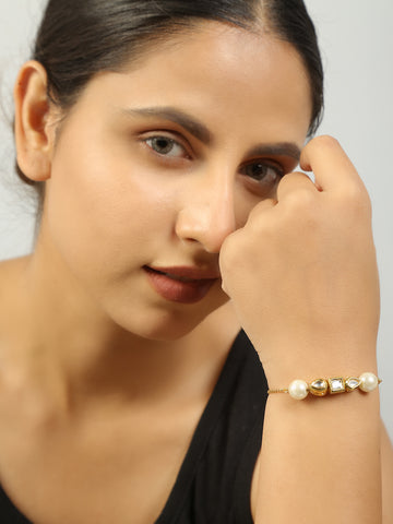 Gold toned kundan inspired bracelet with pearls